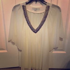 White with glitter beads on a v-neck line